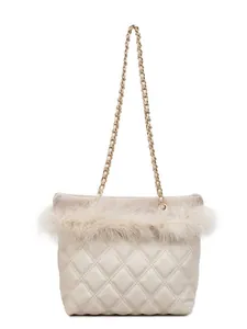 Quilted crossbody bag with feather trim and gold chain strap in cream white finish