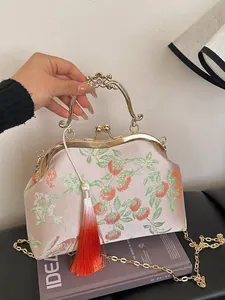 Vintage style pink silk clutch bag with persimmon embroidery and gold handle