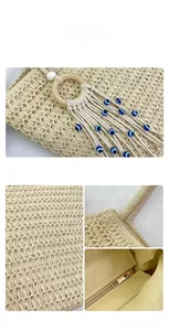 Détails du sac cabas en paille avec pompon en perles et poche intérieure zippée sûre
