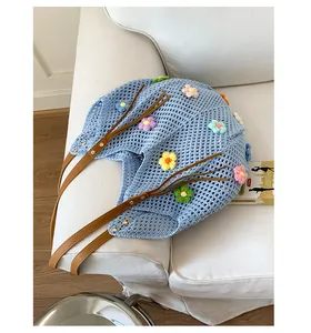 Detail of hollow knit shoulder bag with 3D colorful flowers and brown faux leather strap