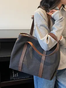 Deep grey canvas tote bag with leather straps and minimalist large capacity design
