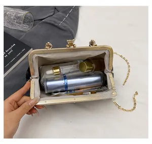 Internal view of the retro clasp purse showing capacity for perfume and cosmetics