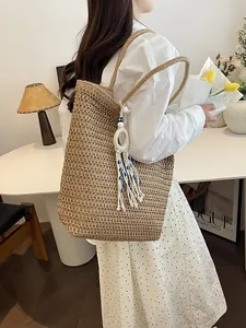 Grand sac cabas de plage en paille tressée avec pompon œil bleu et double bandoulière