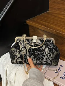 Retro floral jacquard kiss-lock handbag with gold metal handle and chain strap