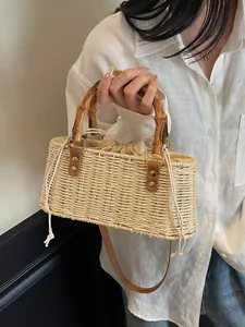 Bolso de paja hecho a mano con asas de bambú y correa de cuero para vacaciones de playa