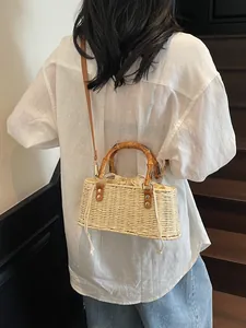 Bolso de paja tejido a mano con asa de bambú y correa de cuero para vacaciones de playa