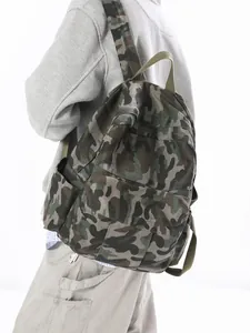 Classic jungle camo canvas backpack for men and women with large capacity on a model