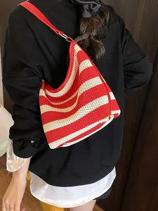 Red and white striped knit hobo shoulder bag with red leather trim and adjustable strap