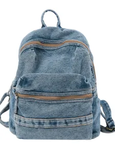 Vintage light blue washed denim backpack with dual zipper compartments and top handle