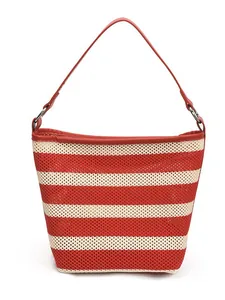 Large red and white striped knit bucket bag with sleek leather handle and silver rings