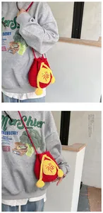 Detail of red and yellow knitted lucky pouch bag with Fu character embroidery