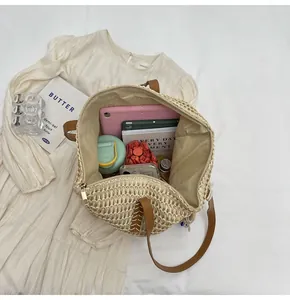 Detailed interior of large straw tote bag showing spacious storage for daily essentials