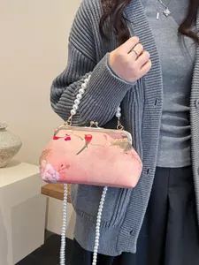Pink Chinese style embroidery bag with floral bird patterns and pearl chain handle