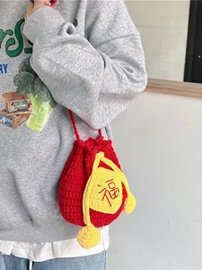 Handmade red crochet lucky bag purse with traditional Fu character and yellow pom-poms