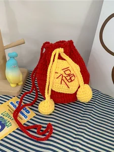 Handmade red crochet drawstring bag with yellow Fu character pattern for good luck