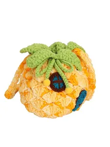 Handmade knitted pineapple house mini crossbody bag with green leaf drawstring closure