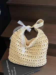Sac à bandoulière chic en paille tressée creuse avec nœud en dentelle pour vacances d'été