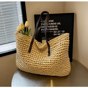 Detail of the high-quality woven texture and reinforced leather handles on a summer tote