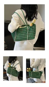 Detail of green woven tote bag with drawstring lining and decorative tulips