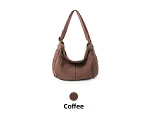 Close-up of coffee brown vintage canvas messenger bag with adjustable strap and side pocket