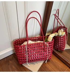 Detail of red hollow woven tote bag with drawstring lining for beach vacation style