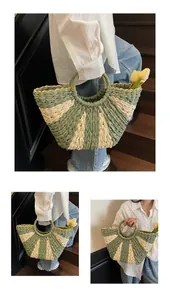 Detail of hand-woven straw bag with green radial stripes and round top handles