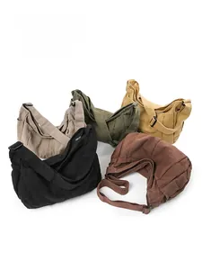 Detailed view of heavy-duty canvas messenger bags in five colors with adjustable straps