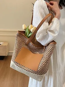 Borsa tote bicolore in paglia con spalline in pelle marrone e tasca frontale