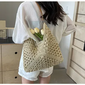Detail of hollow woven beach bag with premium leather strap and diamond crochet pattern