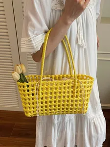 Yellow hollow woven beach bag with drawstring liner for summer vacation outings