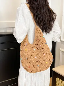Handmade crochet shoulder bag with colorful pearls for women, ideal for beach beach travel