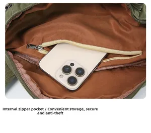Internal view of the canvas bag showing the zippered inner pocket and brown lining detail