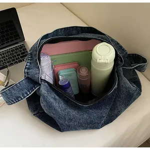 Interior view showing the large capacity of this denim tote bag for daily essentials