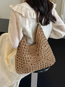 Hollow knit straw tote bag for beach vacations with large capacity and hobo shoulder strap
