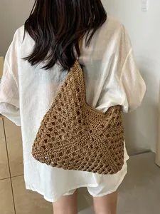 Brown hollow crochet woven shoulder bag for women summer beach vacation style