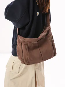 Vintage brown canvas messenger bag with adjustable wide strap for casual daily use