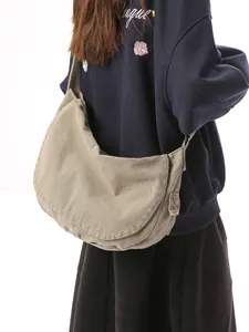 Large khaki canvas crossbody bag with minimalist half-moon flap design for daily casual use