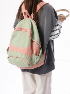 Lightweight color-block canvas backpack in mint green and peach for travel and commute