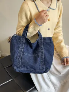 Deep blue denim tote bag with contrast stitching and large capacity for daily casual use