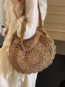 Bohemian large capacity straw tote bag with intricate hollow lace weaving for beach holidays
