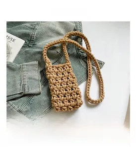 Close-up of khaki crochet cotton rope bag showing detailed handmade hollow weave texture