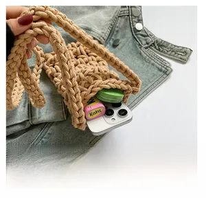 Detail view of the hand-woven hollow cotton mini bag showing its compact capacity