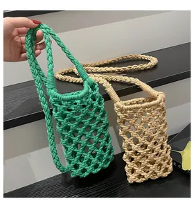 Macro detail of handmade crochet net bag showing green and khaki woven rope texture