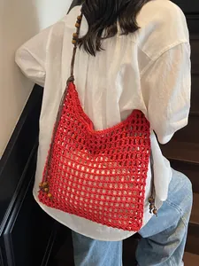 Red handmade crochet woven tote bag with wooden beads decoration for beach vacations