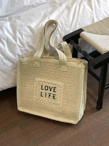 Large woven beach tote bag in beige with Love Life lettering and sturdy top handles