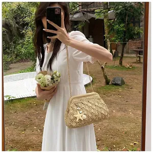 Detail of straw woven bag with seashell charms, gold chain, and wave texture