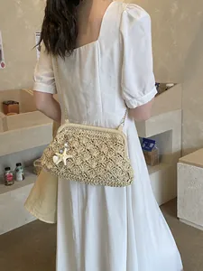 Vintage straw woven crossbody bag with starfish charm and gold chain for summer beach vacations