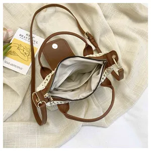 Detail view of woven bag showing inner lining, zipper pocket, and leather magnetic flap
