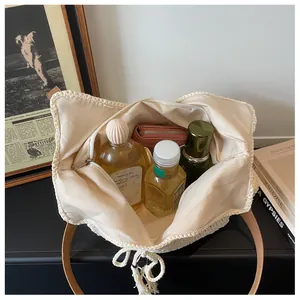 Interior view of large cotton crochet tote bag showing spacious capacity for cosmetics