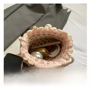 Detail of hand-woven bucket bag interior with floral lining and spacious capacity